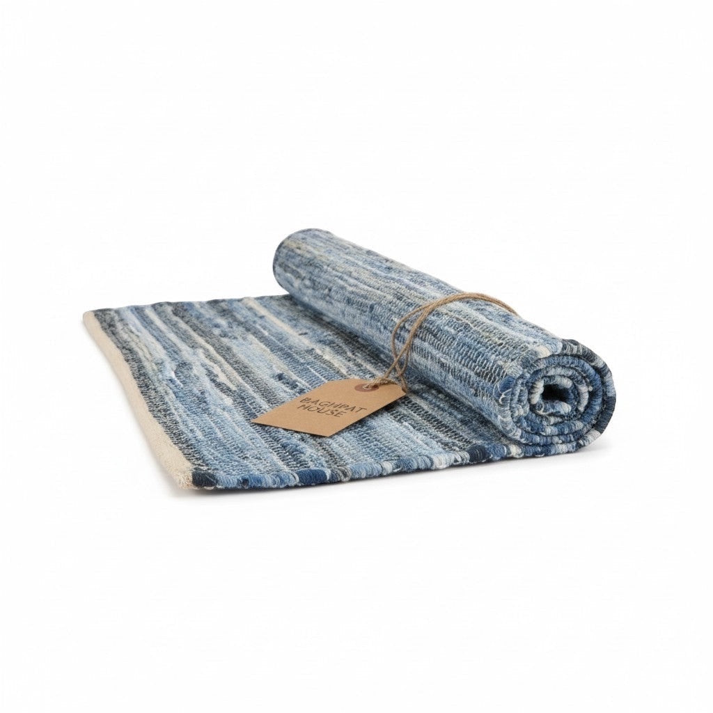 Baghpat House Kirsehir flat-woven jute rug in blue and cream with traditional Anatolian kilim geometry.