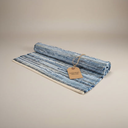 Baghpat House flat-woven jute rug with blue and white stripes, inspired by Anatolian kilim tradition.