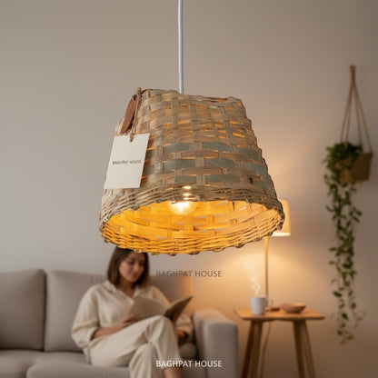 Baghpat House woven bamboo pendant light fixture with a natural, earthy tone and artisanal texture. Creates a warm ambiance.